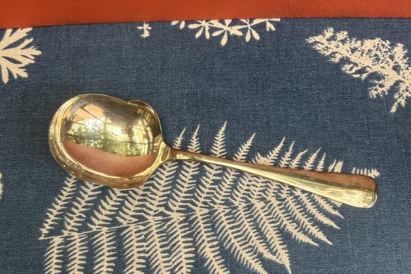 Verzilverde aardappellepel decor Haags lofje